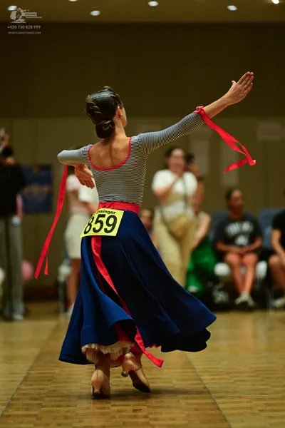 Dancesport competitor #159: ** Red latin dress
*   **Color:** Primarily red