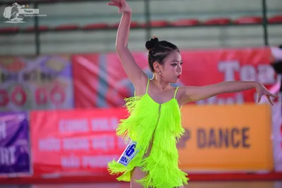 Dancesport competitor: ** Female
*   **Color:** Bright, vibrant green