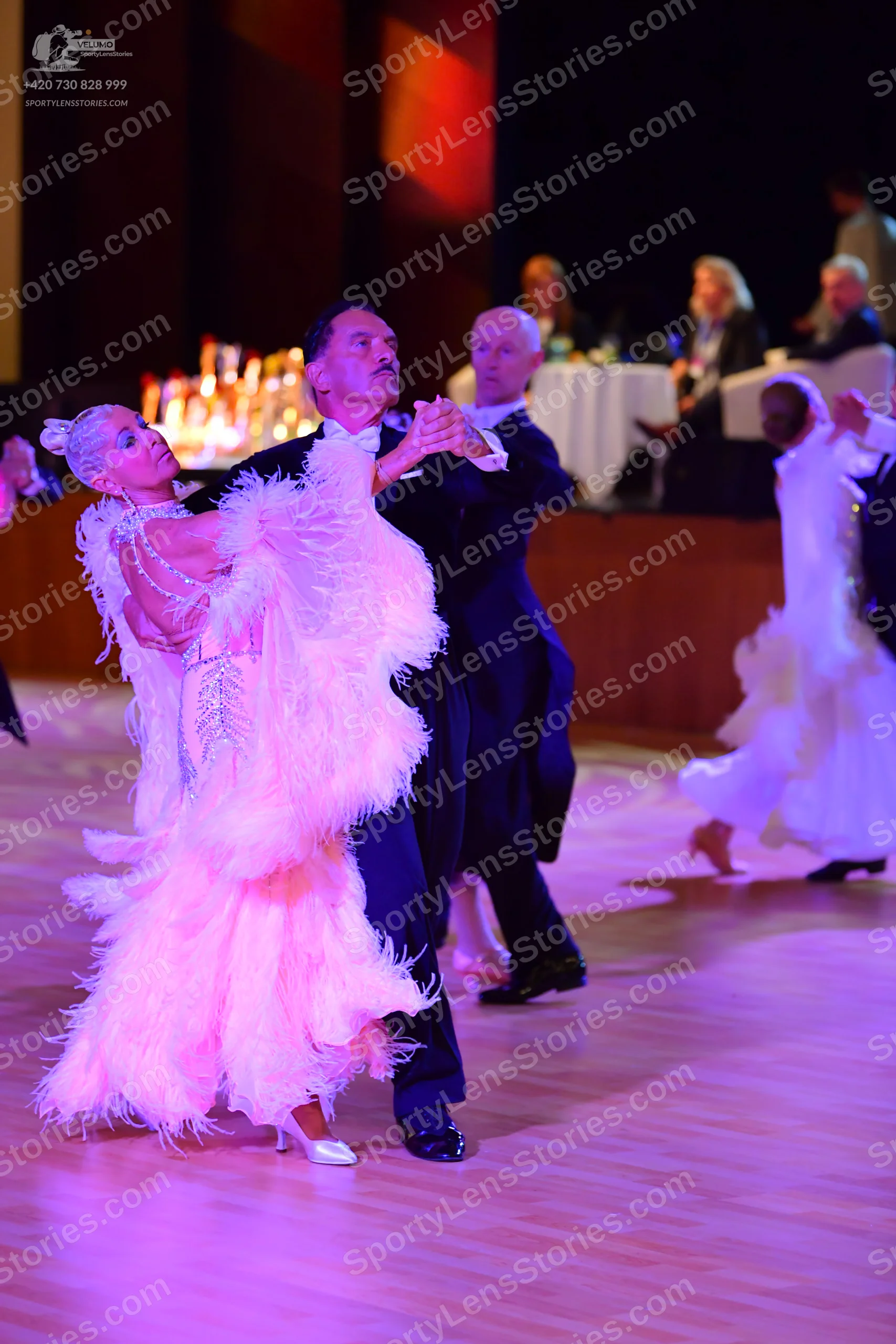 Dancesport competitor: ** Pink Latin Dress
*   **Color:** Primarily light pink with darker pink accents