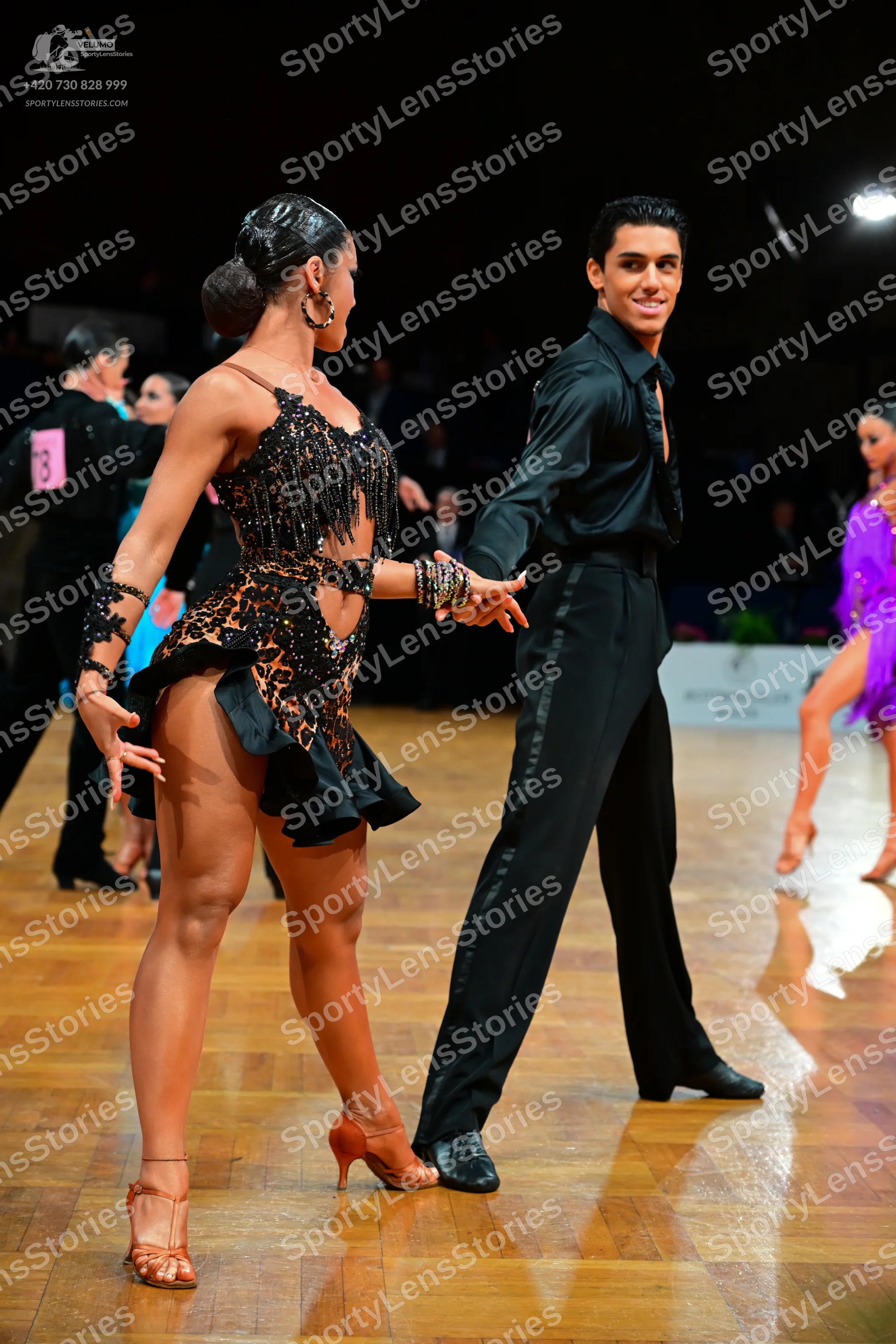 Dancesport competitor: Male dancer: black long-sleeved dance shirt and black dance trousers