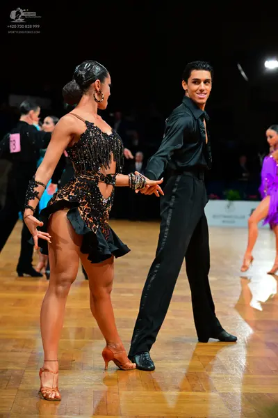 Dancesport competitor: Male dancer: black long-sleeved dance shirt and black dance trousers