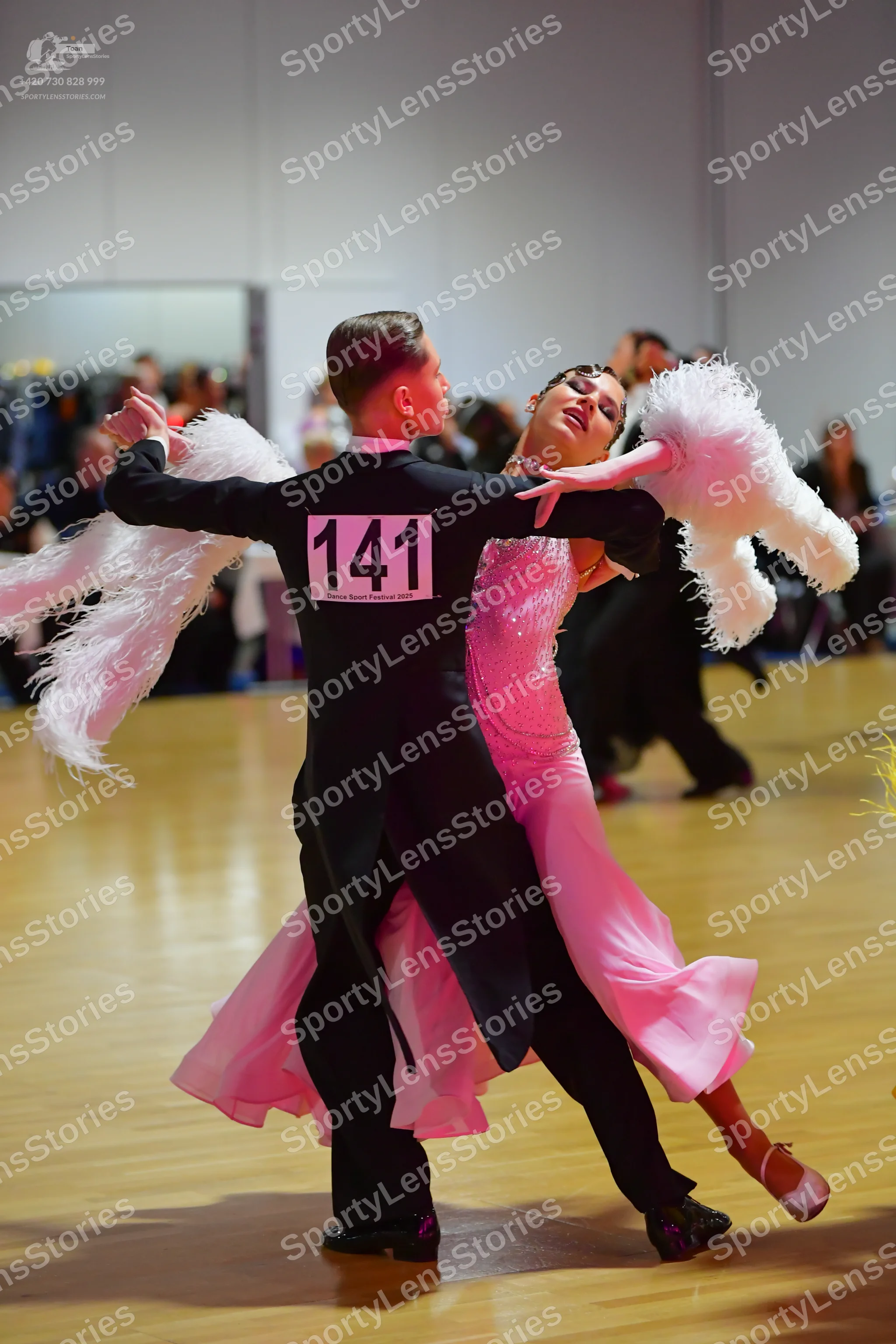 Dancesport competitor #141: Male dancer: black tailcoat, white shirt, and black trousers