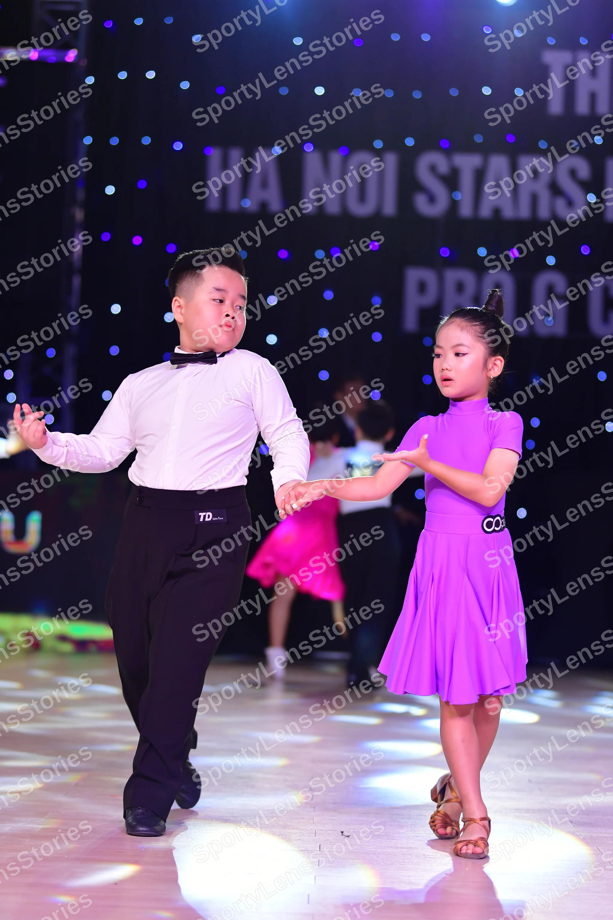Dancesport competitor: ** Black suit with a sequin lapel