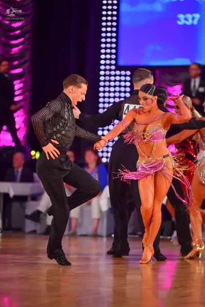Dancesport competitor #44: Male dancer: black long-sleeved textured shirt and black trousers