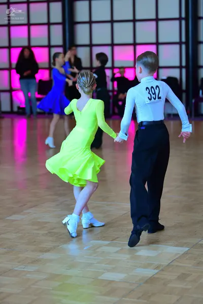 Dancesport competitor #392: Male dancer: white long-sleeved shirt and black trousers