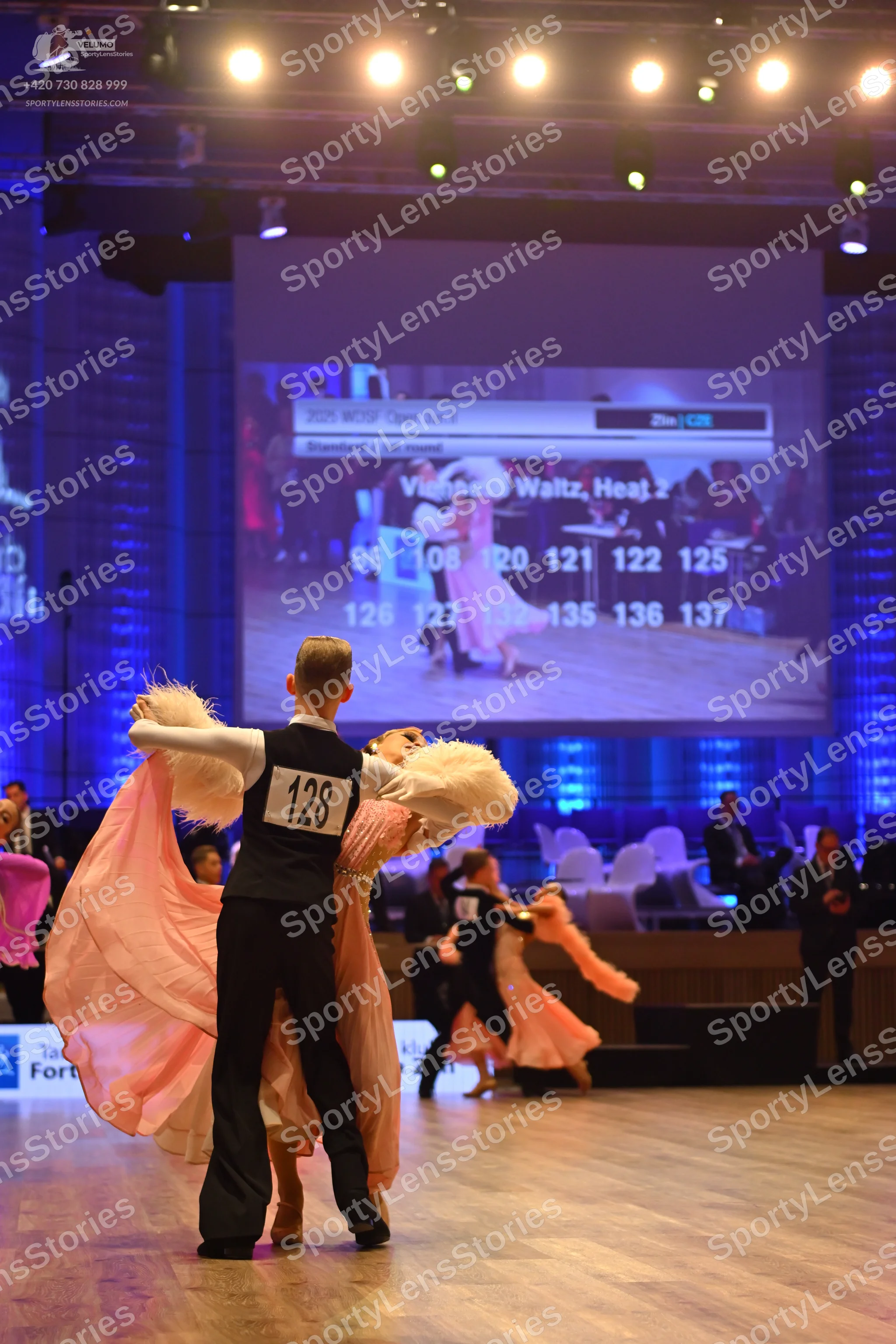 Dancesport competitor: Male dancer: black waistcoat over a white shirt and black trousers