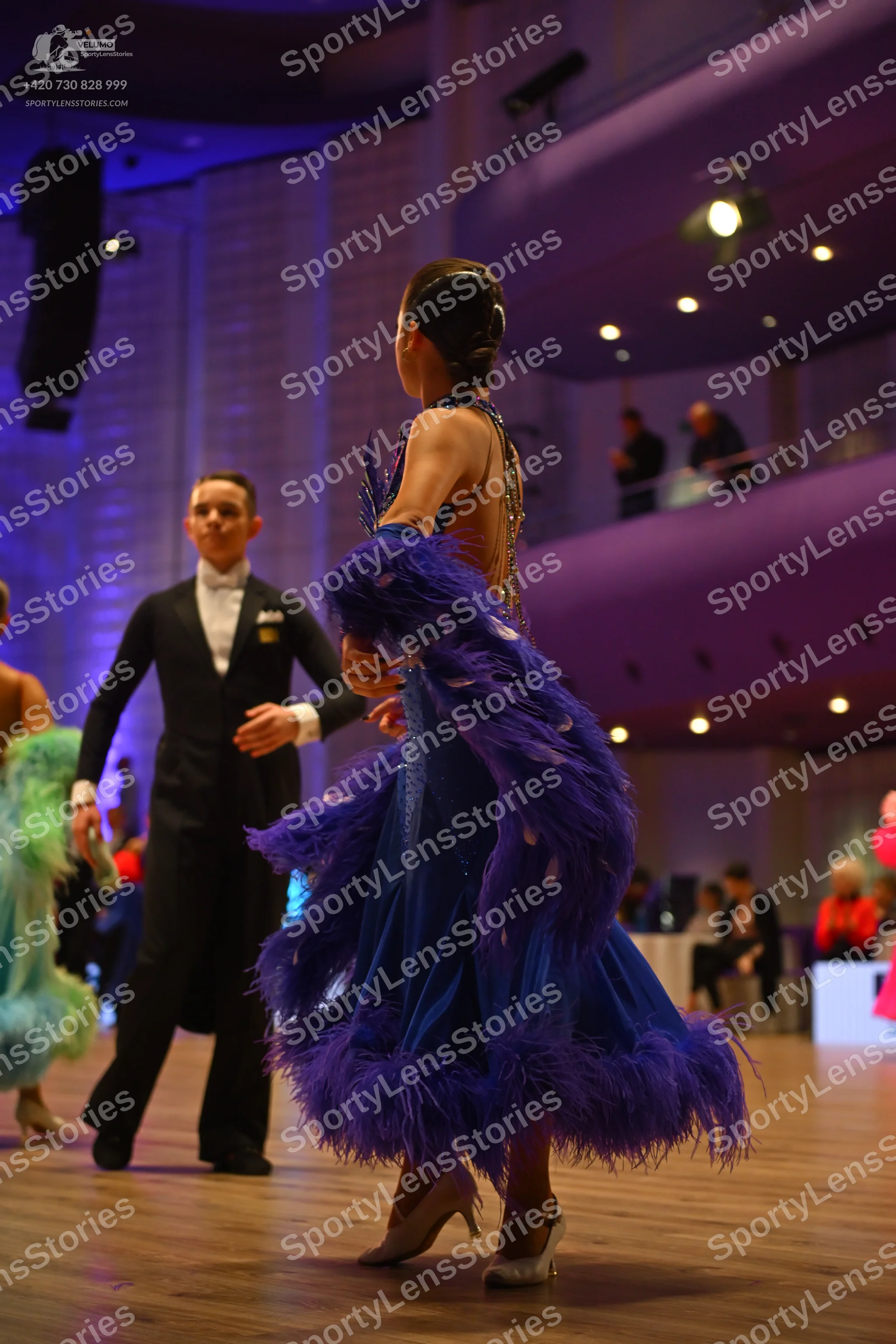 Dancesport competitor: Male dancer: black suit, white shirt, and white bow tie