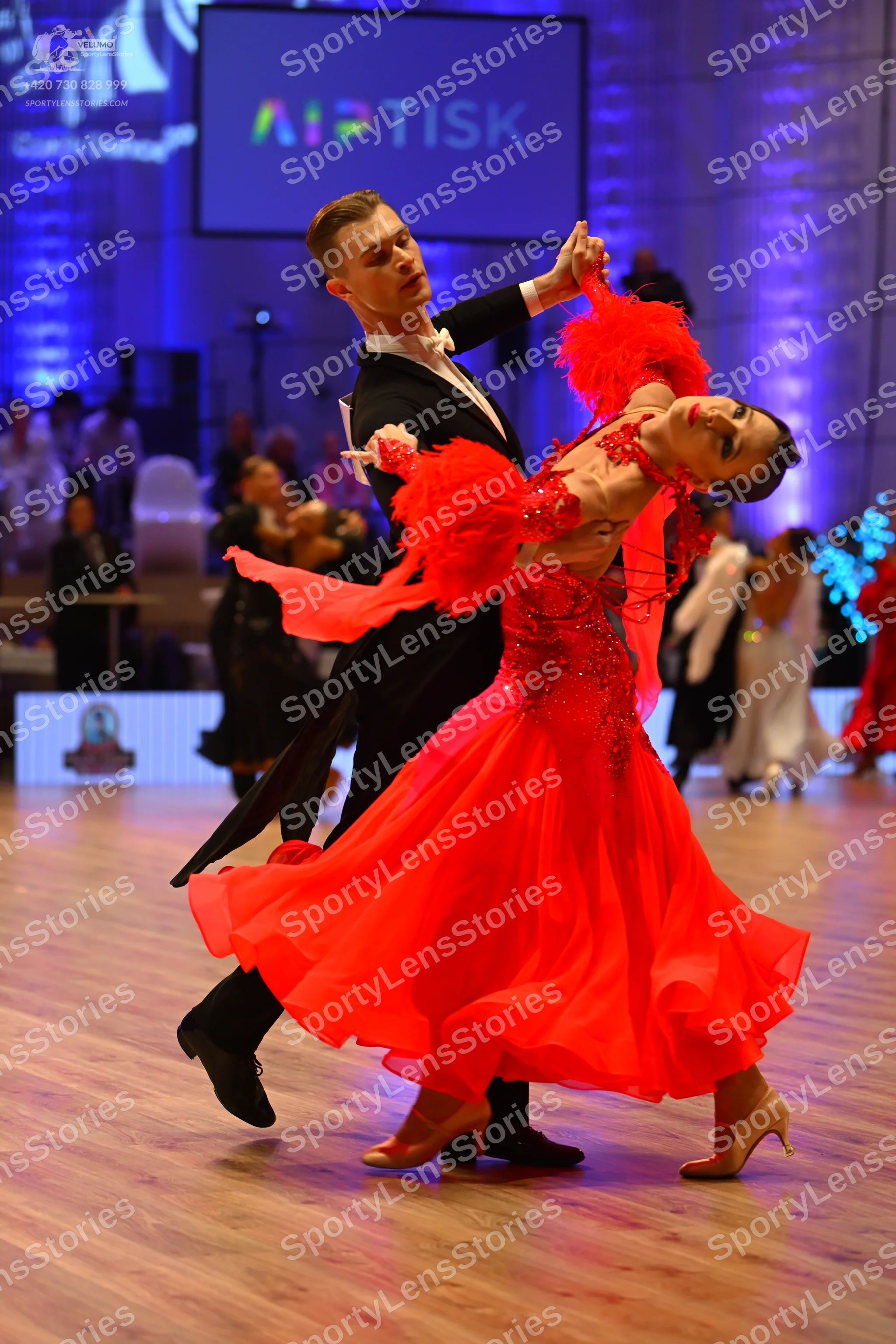 Dancesport competitor: Male dancer: black suit with a white shirt and black bow tie