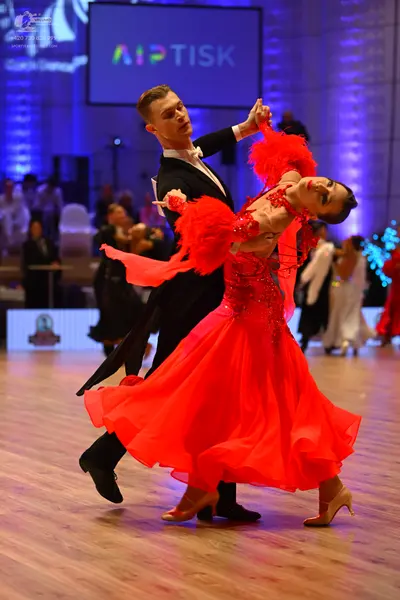 Dancesport competitor: Male dancer: black suit with a white shirt and black bow tie
