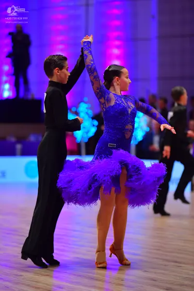 Dancesport competitor: Male dancer: black suit