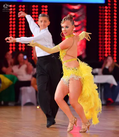 Dancesport competitor: Male dancer: white long-sleeved shirt and black trousers