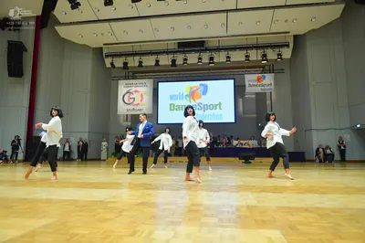 Dancesport competitor: Male dancer: blue suit jacket with satin-like lapels and black trousers