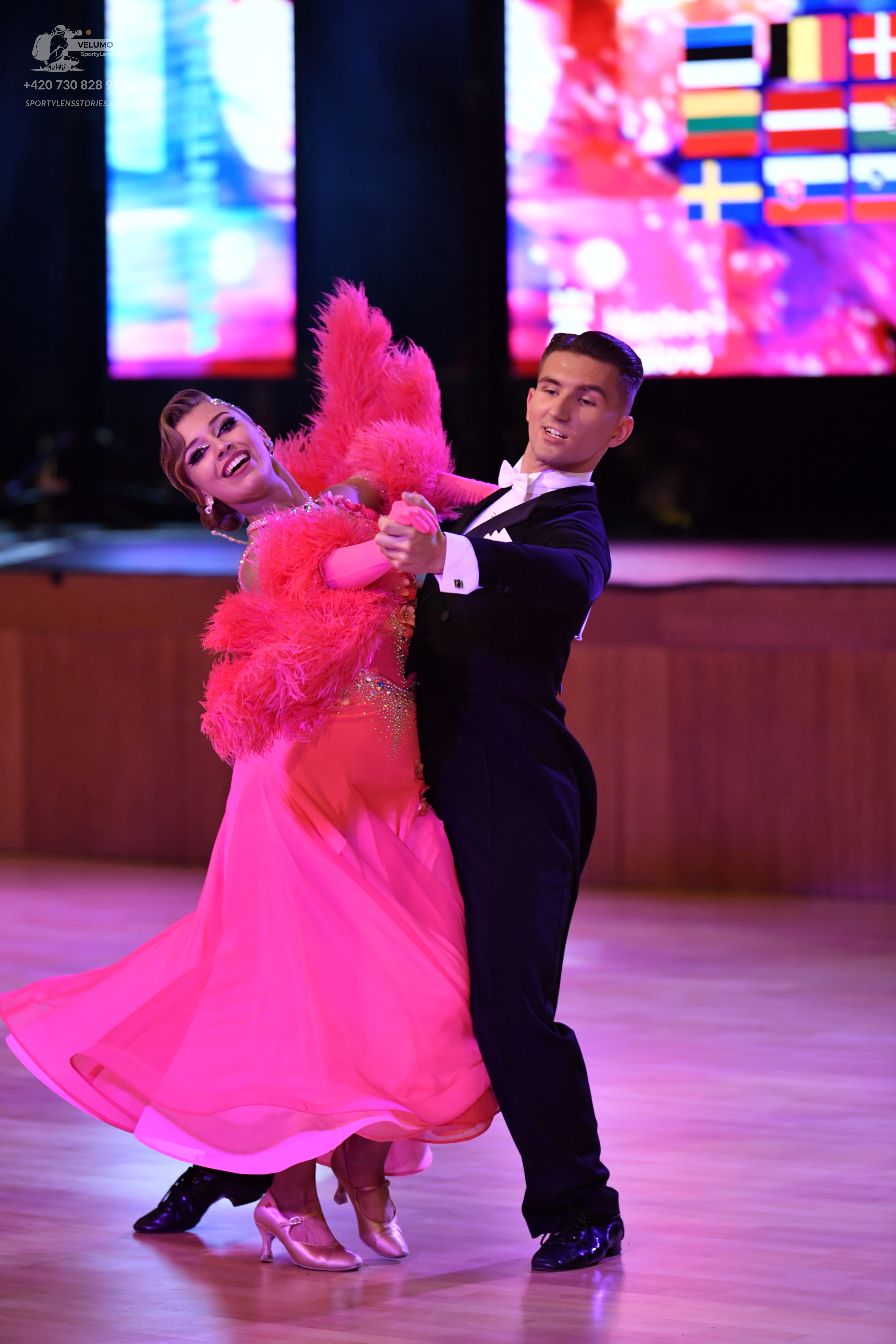 Dancesport competitor: Male dancer: black suit with a white shirt and black bow tie