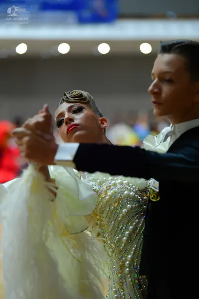 Dancesport competitor: Male dancer: black suit