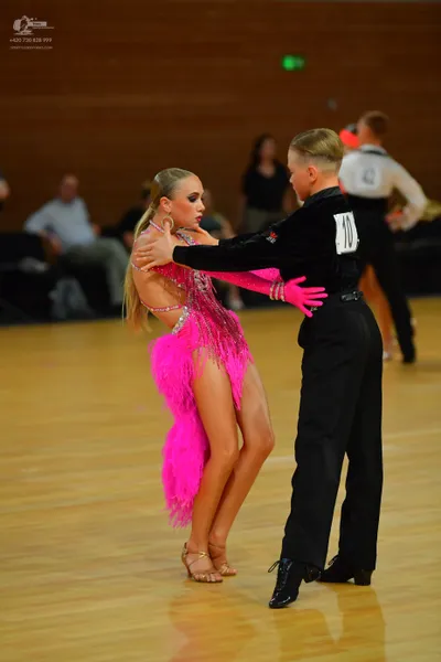 Dancesport competitor: ** Red Latin Dress
*   **Color:** Primarily vibrant red