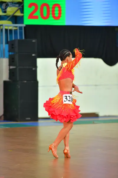 Dancesport competitor #200, #320: Okay, here’s a breakdown of the dancers’ costumes based on the image, formatted 