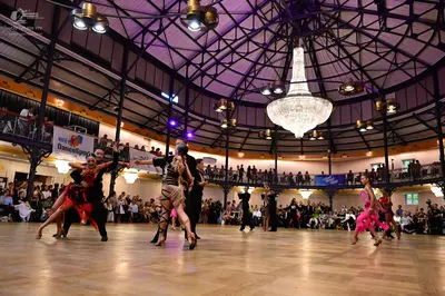 Dancesport competitor: Female dancer: red Latin dress