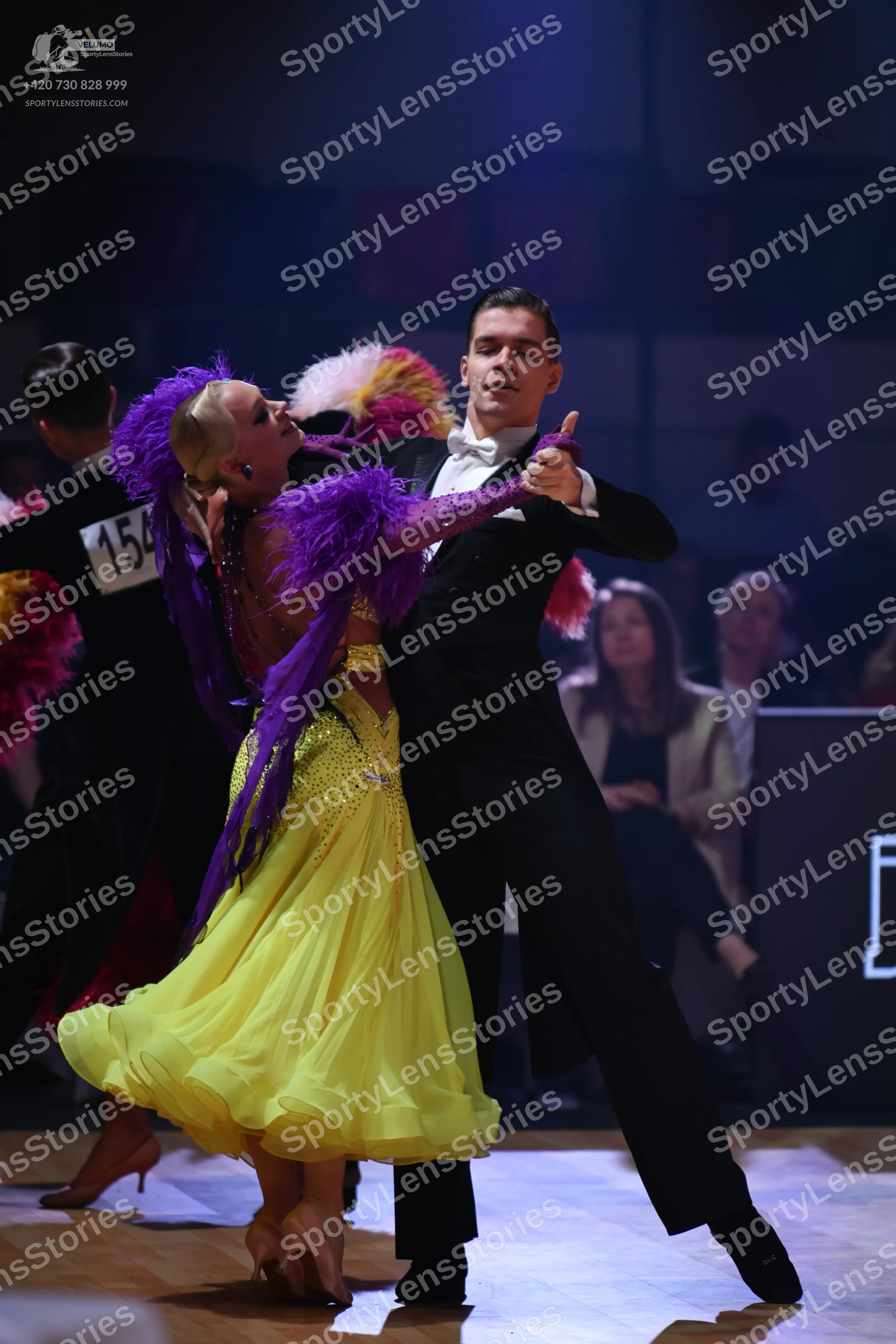 Dancesport competitor: Male dancer: black suit with a white shirt