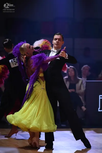 Dancesport competitor: Male dancer: black suit with a white shirt