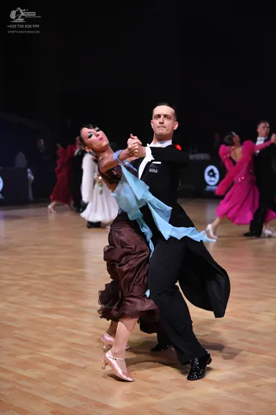 Dancesport competitor: Male dancer: black tailcoat, white shirt, and black trousers