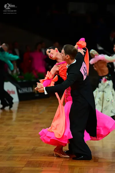 Dancesport competitor #43: Male dancer: black ballroom suit with a white shirt and black trousers