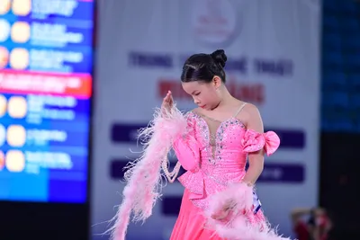 Dancesport competitor: Here's a breakdown of the dancers' costumes in the photo, formatted as requested