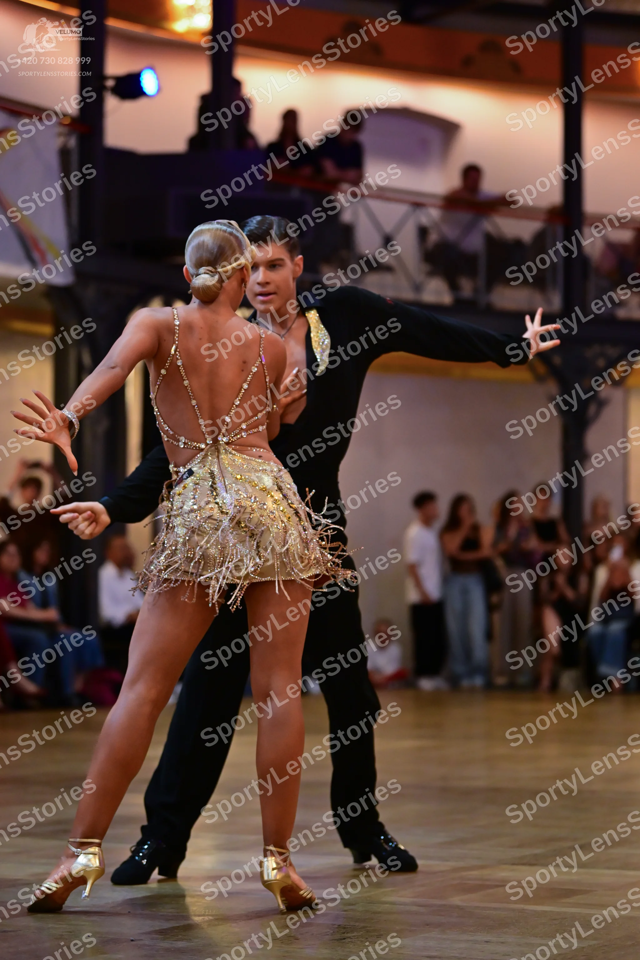 Dancesport competitor: Male dancer: black long-sleeved shirt and trousers with metallic/sequin detail o