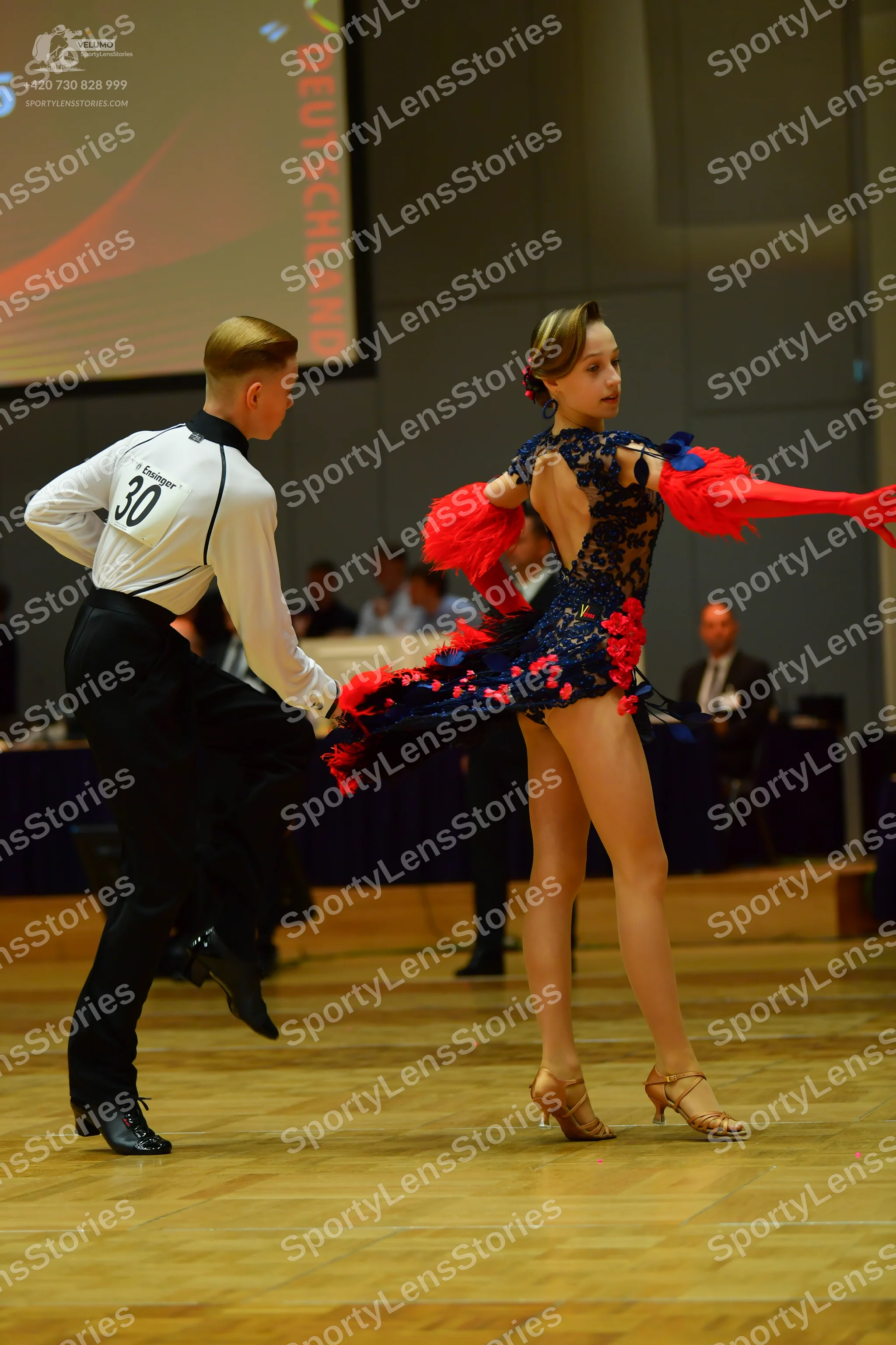 Dancesport competitor: Male dancer: white long-sleeved shirt with black collar and black trousers