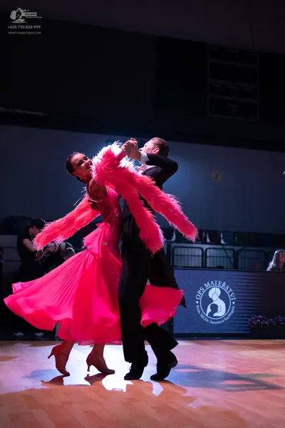 Dancesport competitor: Male dancer: black ballroom suit