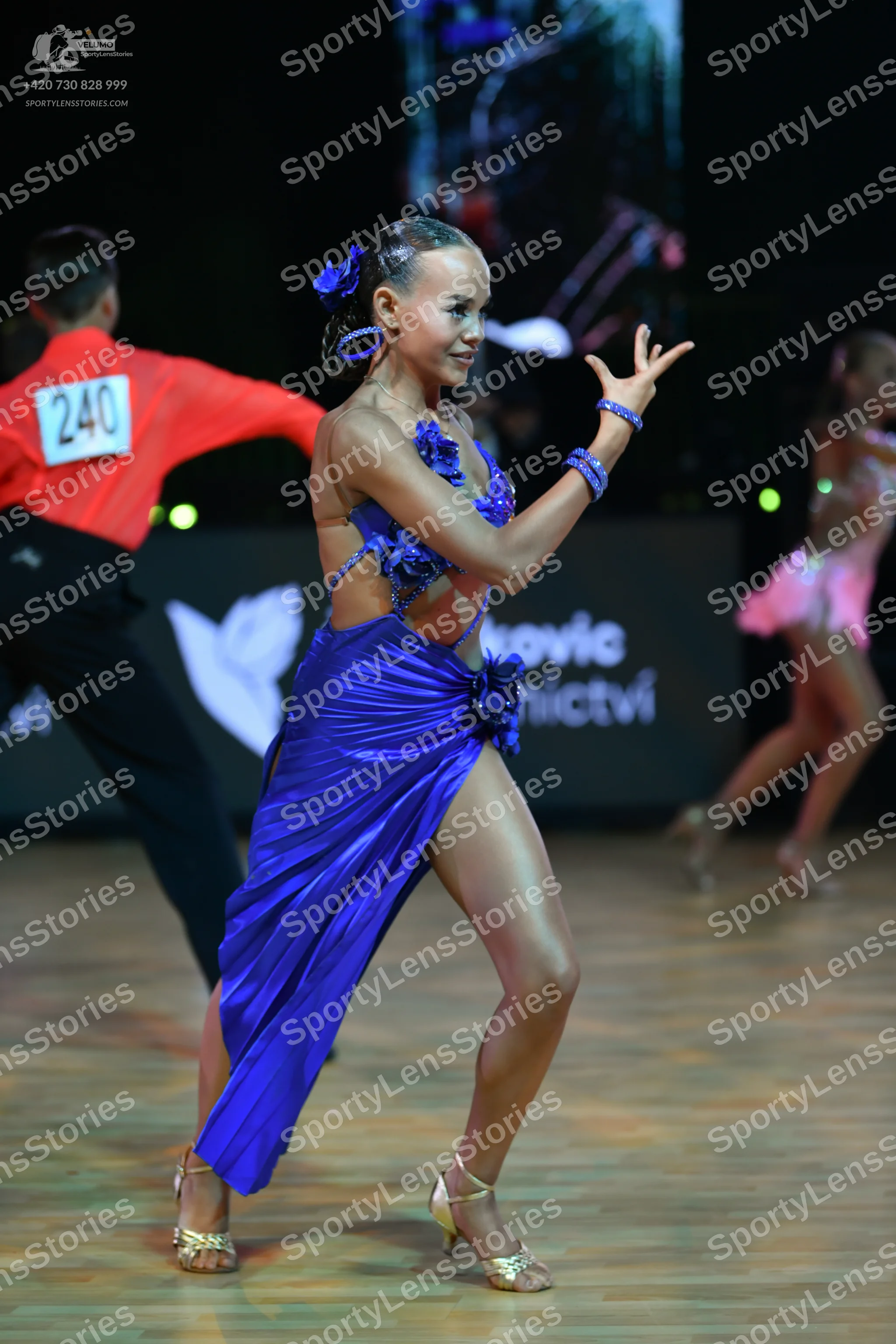 Dancesport competitor: Male dancer: red long-sleeved shirt and black trousers