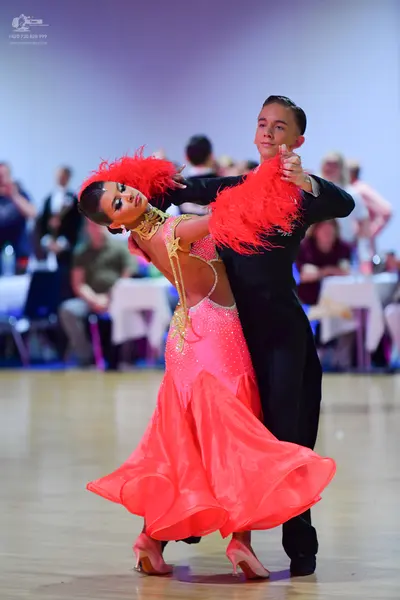 Dancesport competitor: Male dancer: black ballroom suit