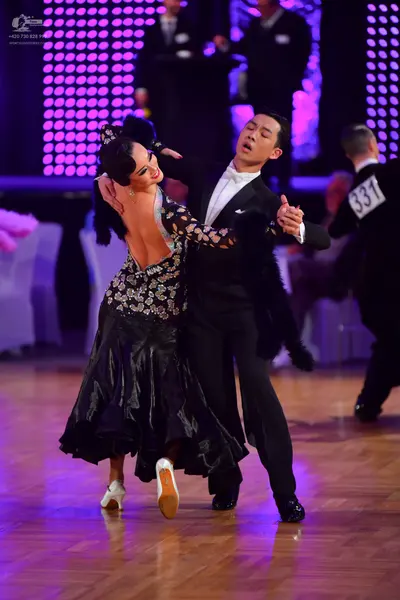 Dancesport competitor #331: Female dancer: black ballroom dress with a sequined, patterned bodice and a full