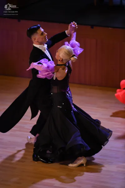 Dancesport competitor: Male dancer: black tailcoat suit with a white shirt and bow tie