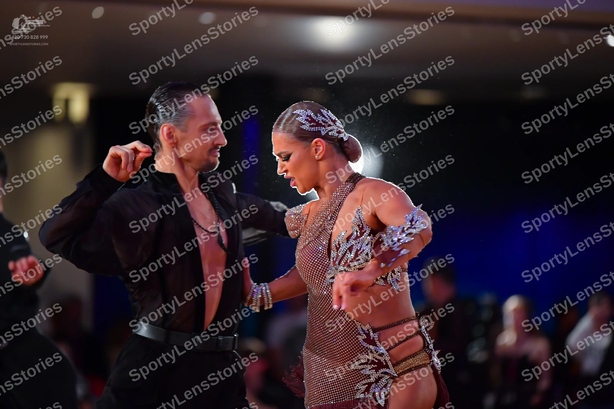 Dancesport competitor: Male dancer: black long-sleeved latin dance shirt, open at the chest, with black