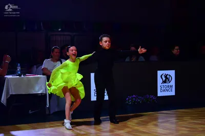 Dancesport competitor: Male dancer: black long-sleeved shirt and black trousers