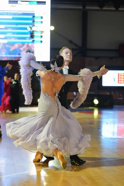 Dancesport competitor: Male dancer: black suit with a white shirt and a black bow tie