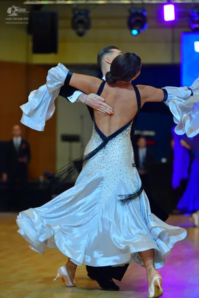 Dancesport competitor: Male dancer: black suit