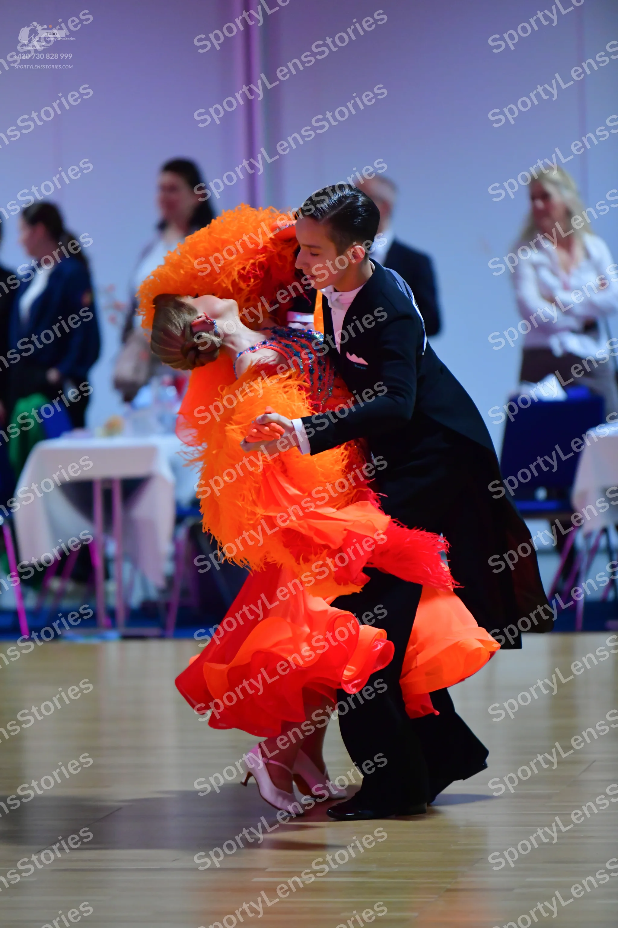 Dancesport competitor: Male dancer: black tailcoat, white shirt, and white pocket square