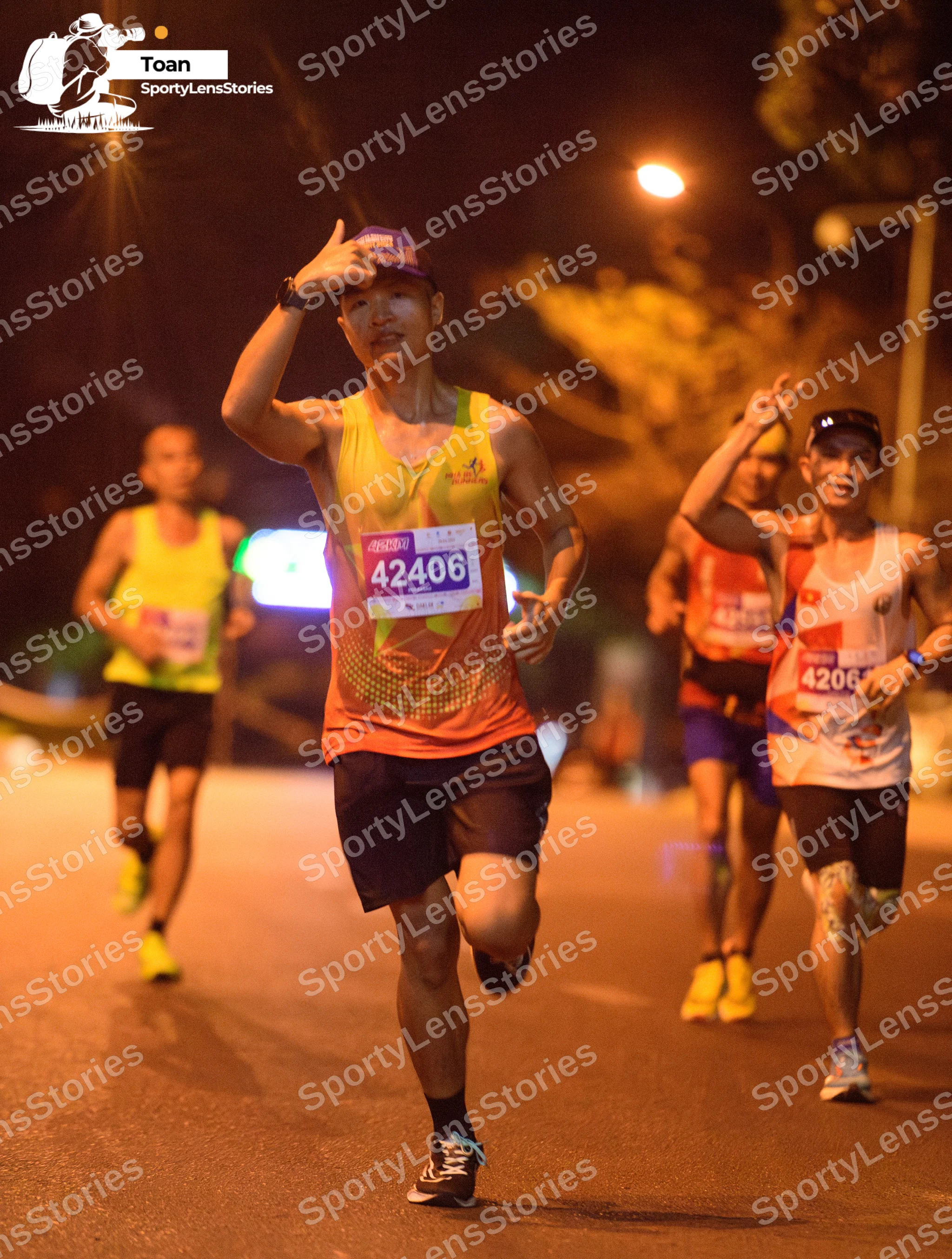 Marathon runner #42406, #4206: Runner 1: yellow tank top, black shorts, black socks, black and white shoes, pur