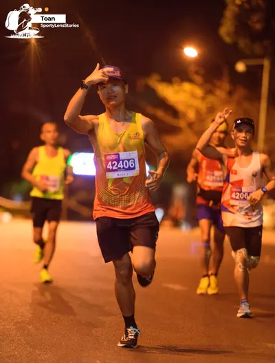 Marathon runner #42406, #4206: Runner 1: yellow tank top, black shorts, black socks, black and white shoes, pur