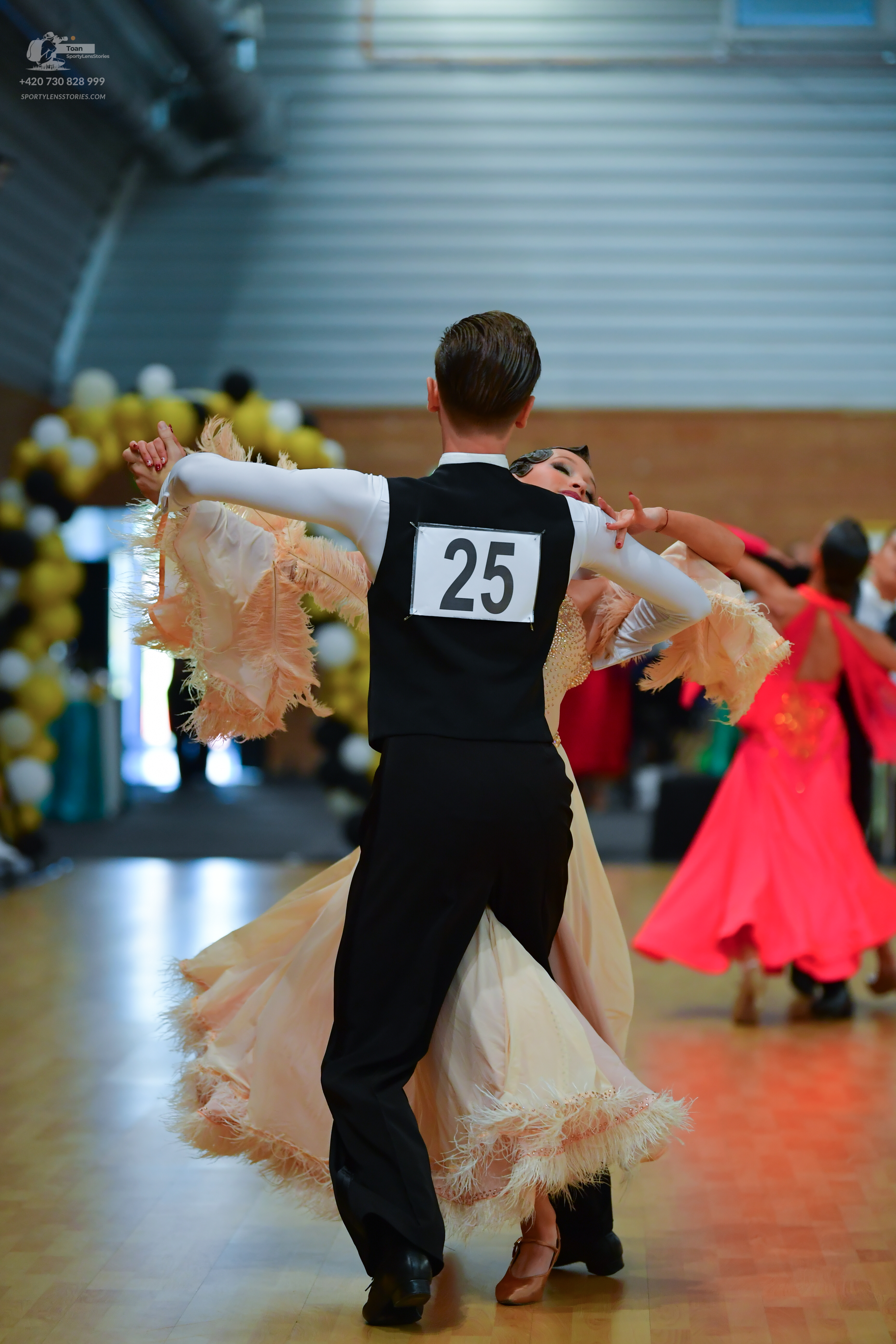 Dancesport competitor #25: ** Black tail suit with white sequin lapels