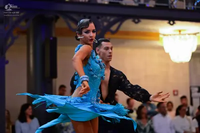 Dancesport competitor: Female dancer: bright blue Latin dance dress with sequin/crystal embellishments 