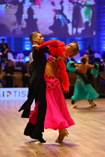 Dancesport competitor: Male dancer: black ballroom tailcoat with a white shirt and black bow tie