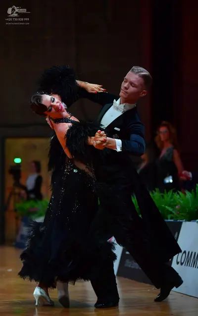 Dancesport competitor: Male dancer: black suit