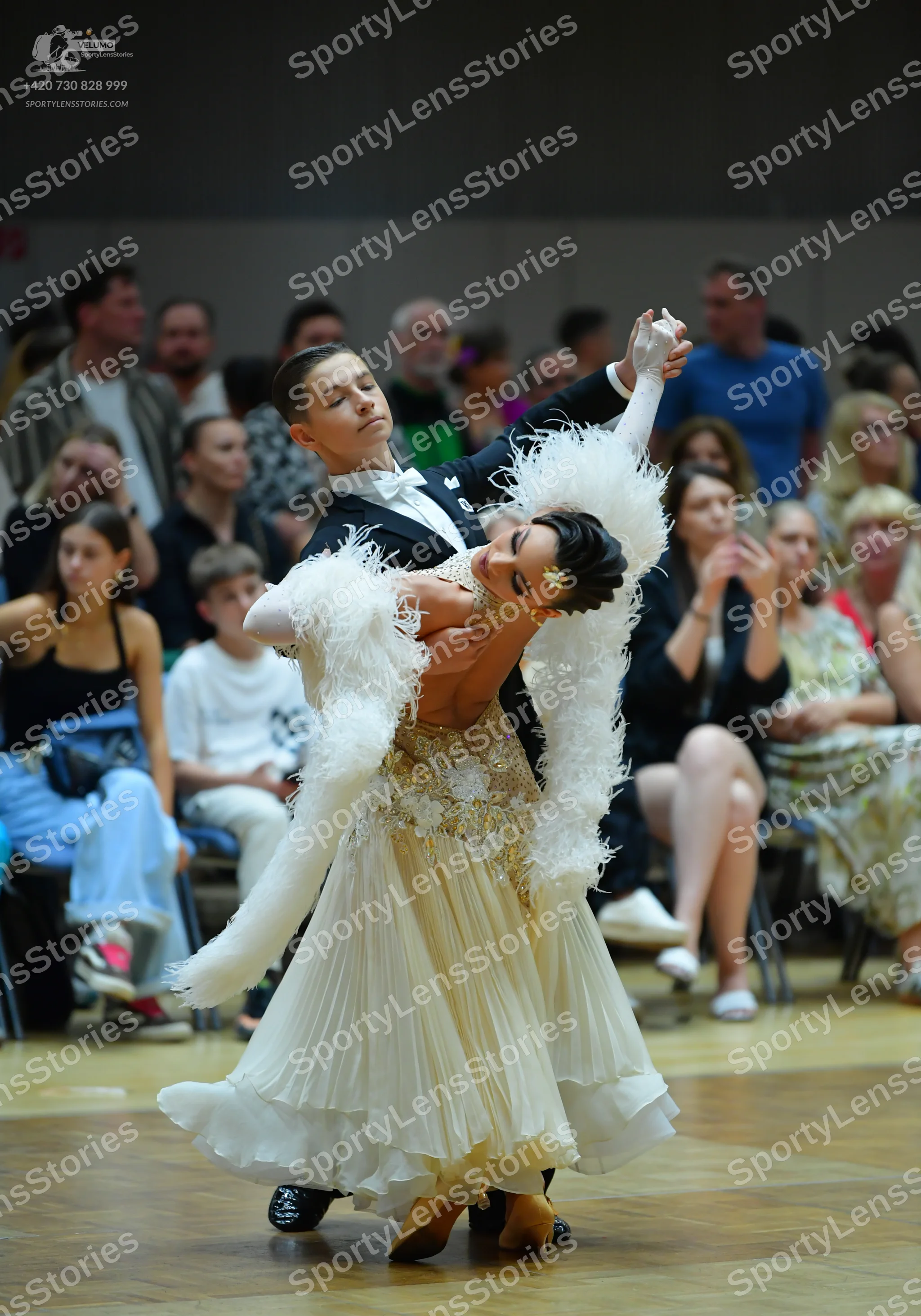 Dancesport competitor: Male dancer: black suit with a white shirt and bow tie