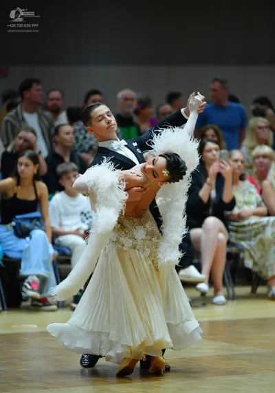 Dancesport competitor: Male dancer: black suit with a white shirt and bow tie