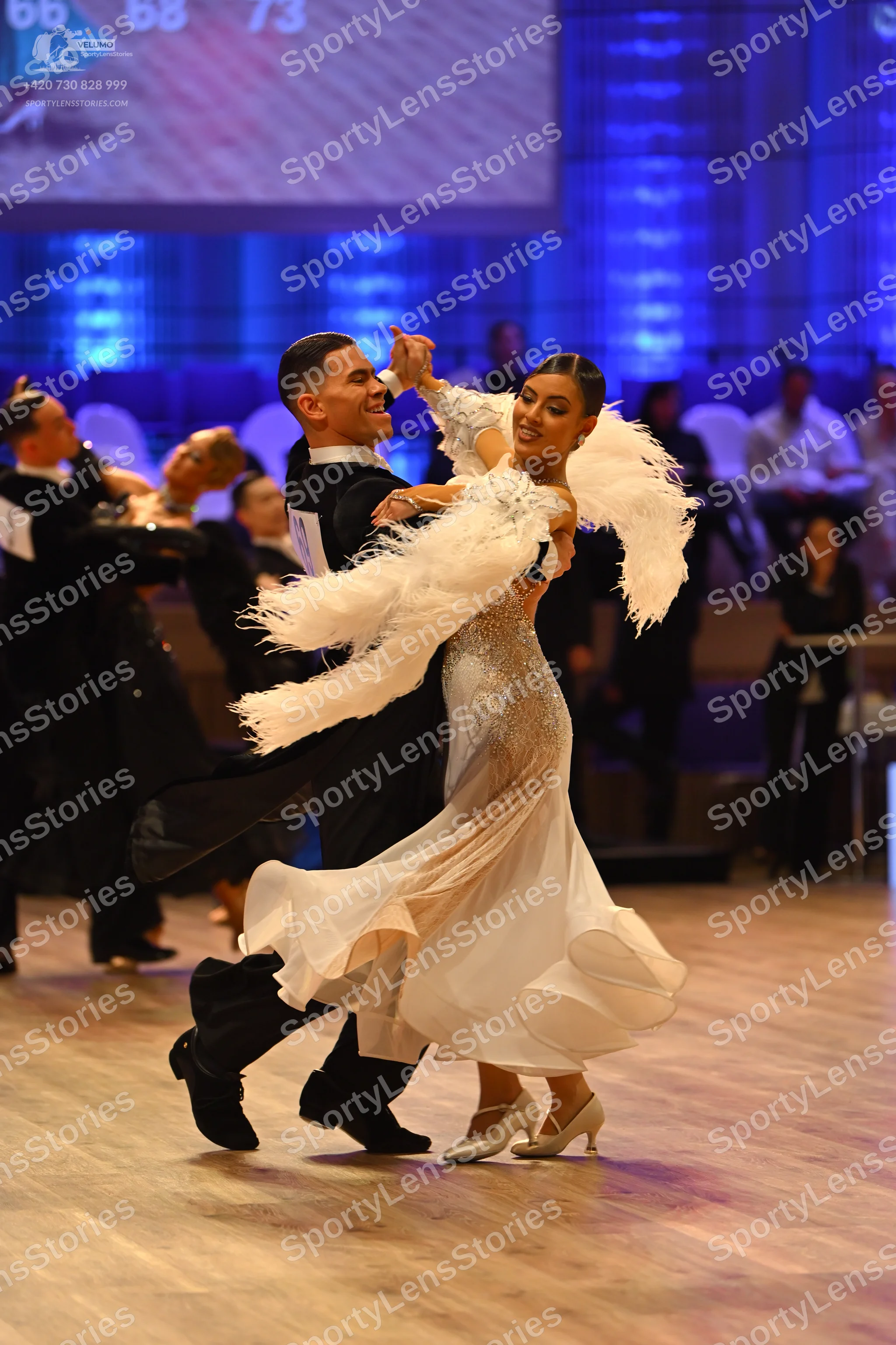 Dancesport competitor: Male dancer: black suit with a white shirt