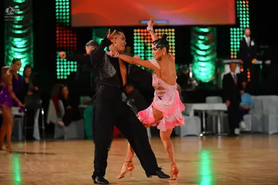 Dancesport competitor: Male dancer: black long-sleeved shirt with sequins on the chest and black trouse