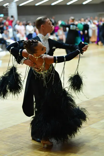 Dancesport competitor: Male dancer: black tailcoat with a white shirt and white bowtie