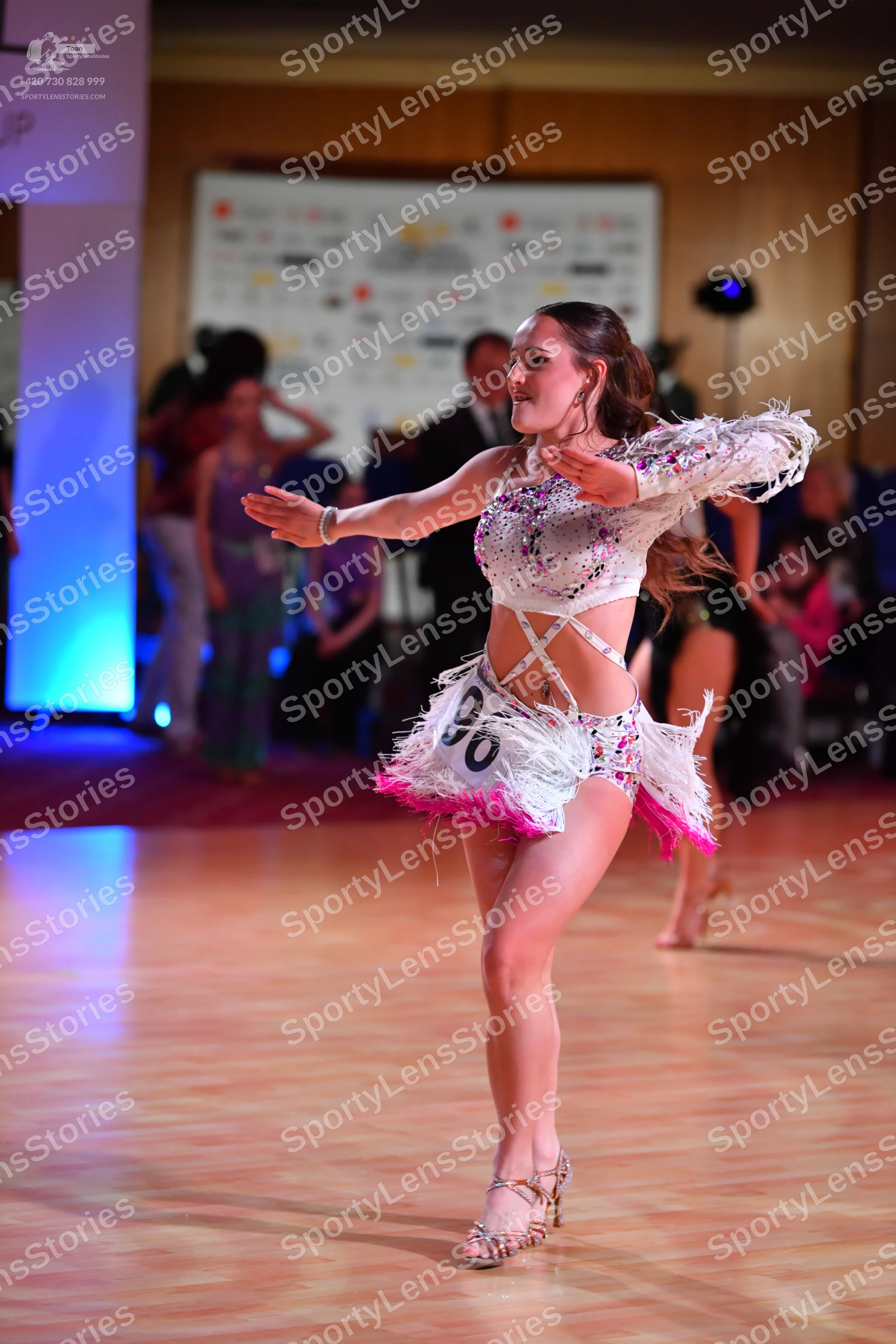 Dancesport competitor: ** Red Latin dress
*   **Fabric:** Appears to be a satin or similar smooth fabri